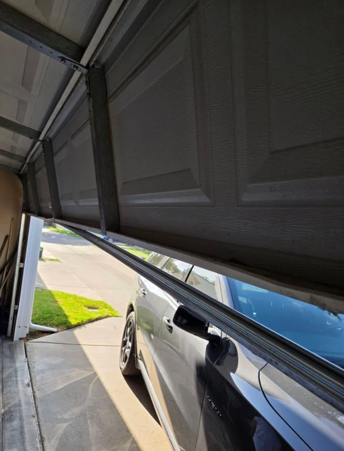 Gallery photos for Bent Bottom Rail and Off-Track Garage Door Fixed in Vineyard Utah: Image #1