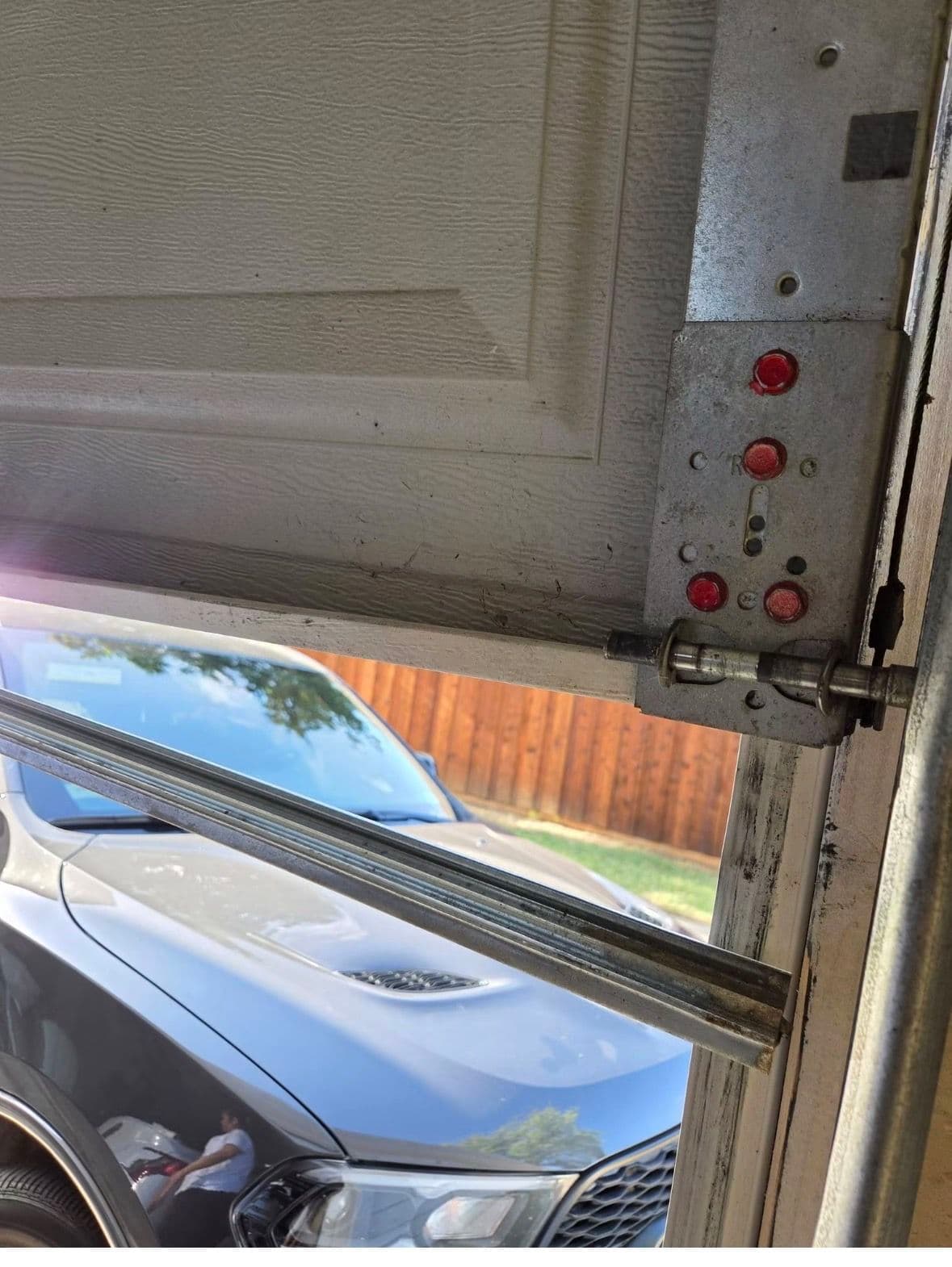 Bent Bottom Rail and Off-Track Garage Door Fixed in Vineyard Utah image