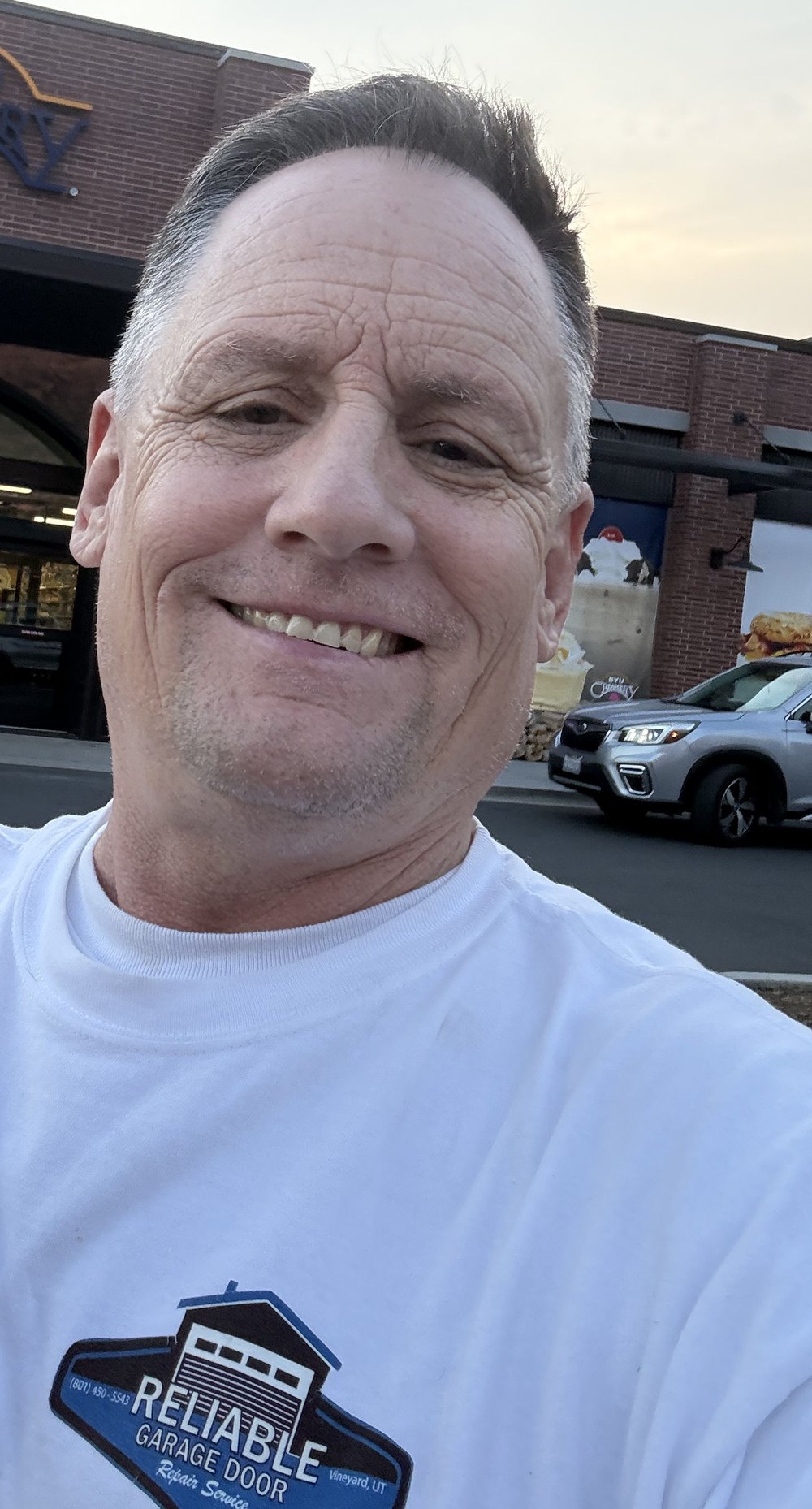 Clark Coffing, owner of Reliable Garage Door Repair Service LLC, in a company shirt