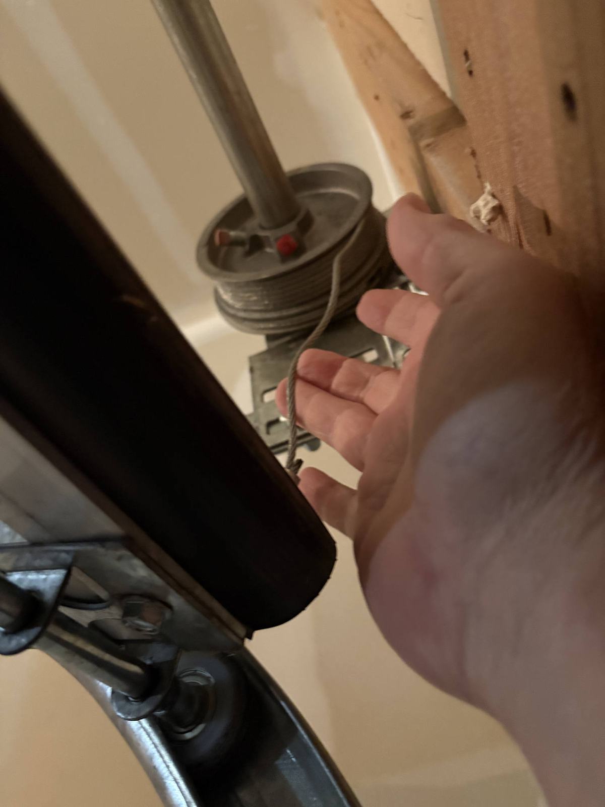 Checking the cable where it winds onto the drum
